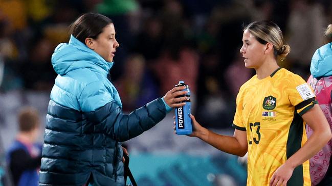 The Aussie skipper watched on and handed out the drinks. (Photo by DAVID GRAY / AFP)