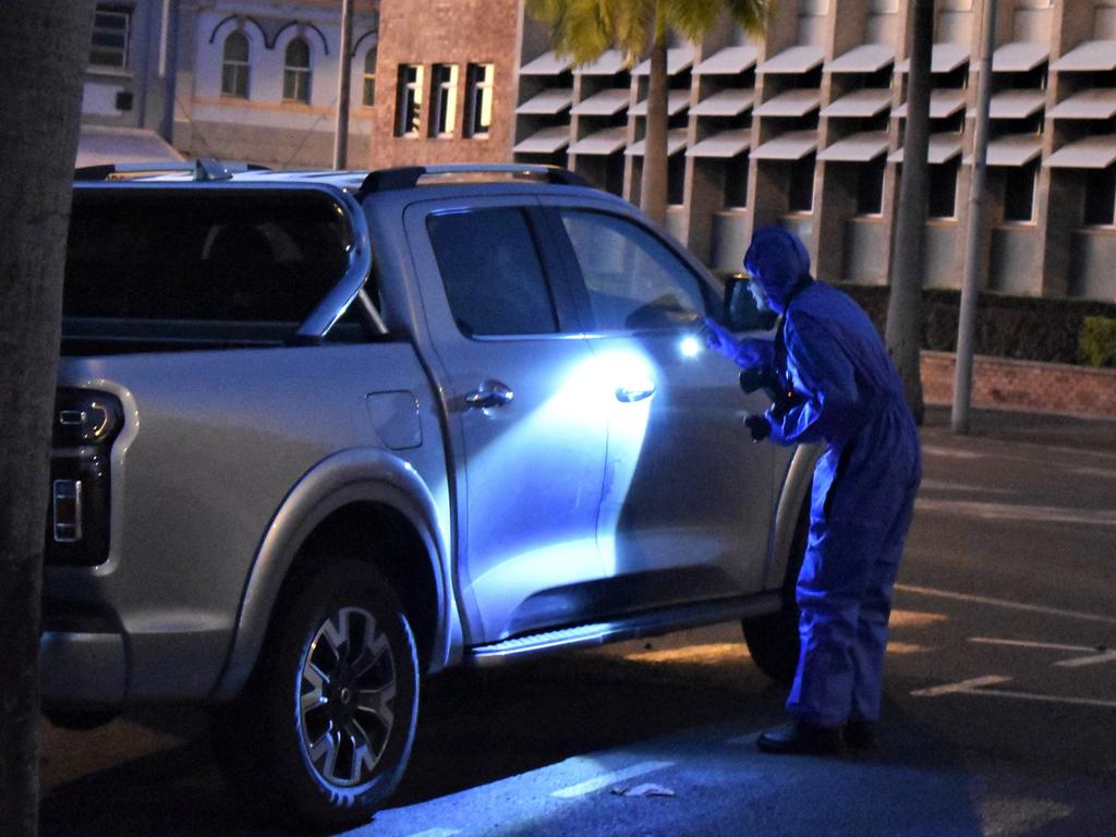 Scene of crime inspecting and photographing the ute Portmoresbey Cecil allegedly drove to the Rockhampton Police Station.