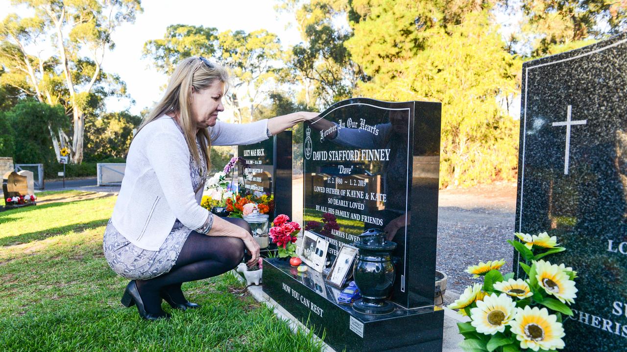 Julie-Ann Finney visits the grave of her son Dave at the Golden Grove Cemetery after the Prime Minister announced a Royal Commission into veteran suicides. Picture: NCA NewsWire / Brenton Edwards