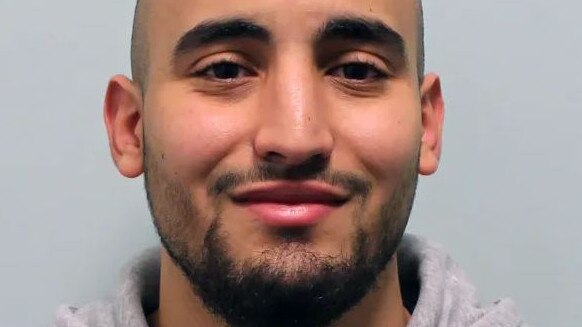 Hitman Anis Hemissi, 24, grinned in his mugshot after being caught by police. Pictured: Supplied