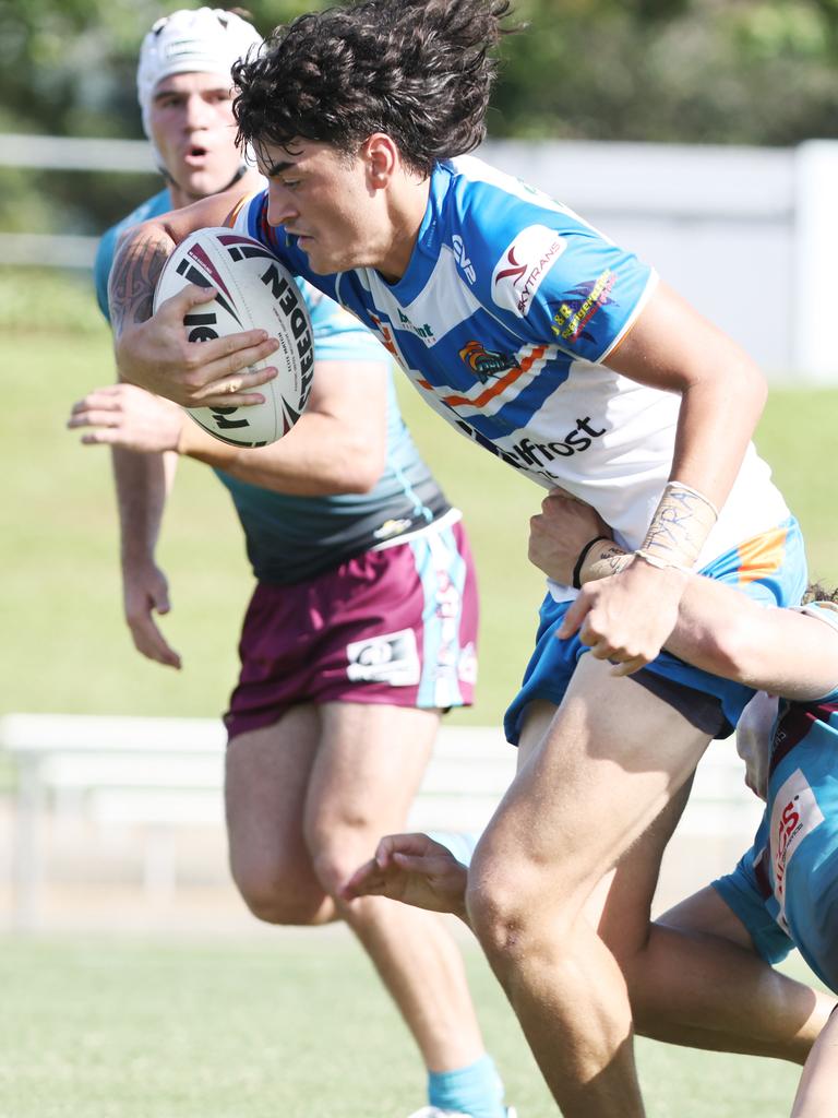 Kees Anderson busts through a tackle in the Queensland Rugby League (QRL) Under 19 Men's match between the Northern Pride and the Mackay Cutters, held at Barlow Park. Picture: Brendan Radke