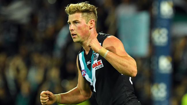 Port's Brett Eddy celebrates kicking a goal. Picture: Tom Huntley