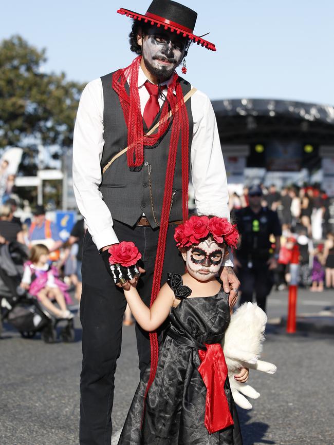 Cel Marsh and Akiza Poto-Marsh, 3, enjoying the family-friendly Halloween street party at Brisbane’s Manly Harbour Village this year. Picture: AAP/Regi Varghese