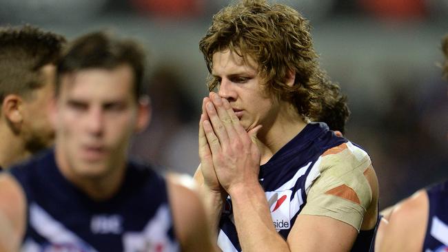 AFL - Fremantle Dockers vs Port Adelaide Power, Patersons Stadium, Perth. Photo by Daniel Wilkins. PICTURED- Fremantle Nathan Fyfe holds his head after the loss to Port Adelaide.