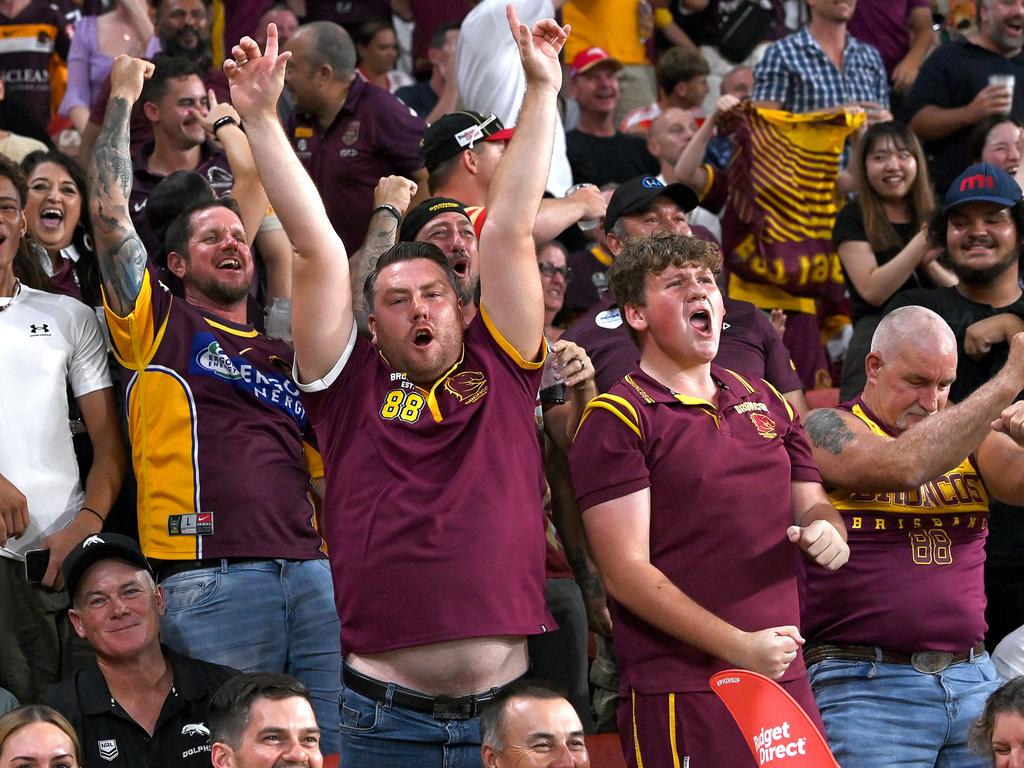 Broncos fans celebrate the match winning try by Kotoni Staggs. Picture: Getty Images