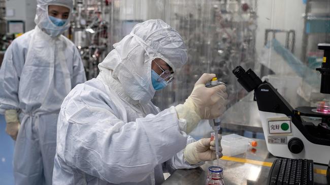 Beijing scientists seen working on a Covid-19 vaccine in April 2020. Picture: Nicolas Asfouri/AFP