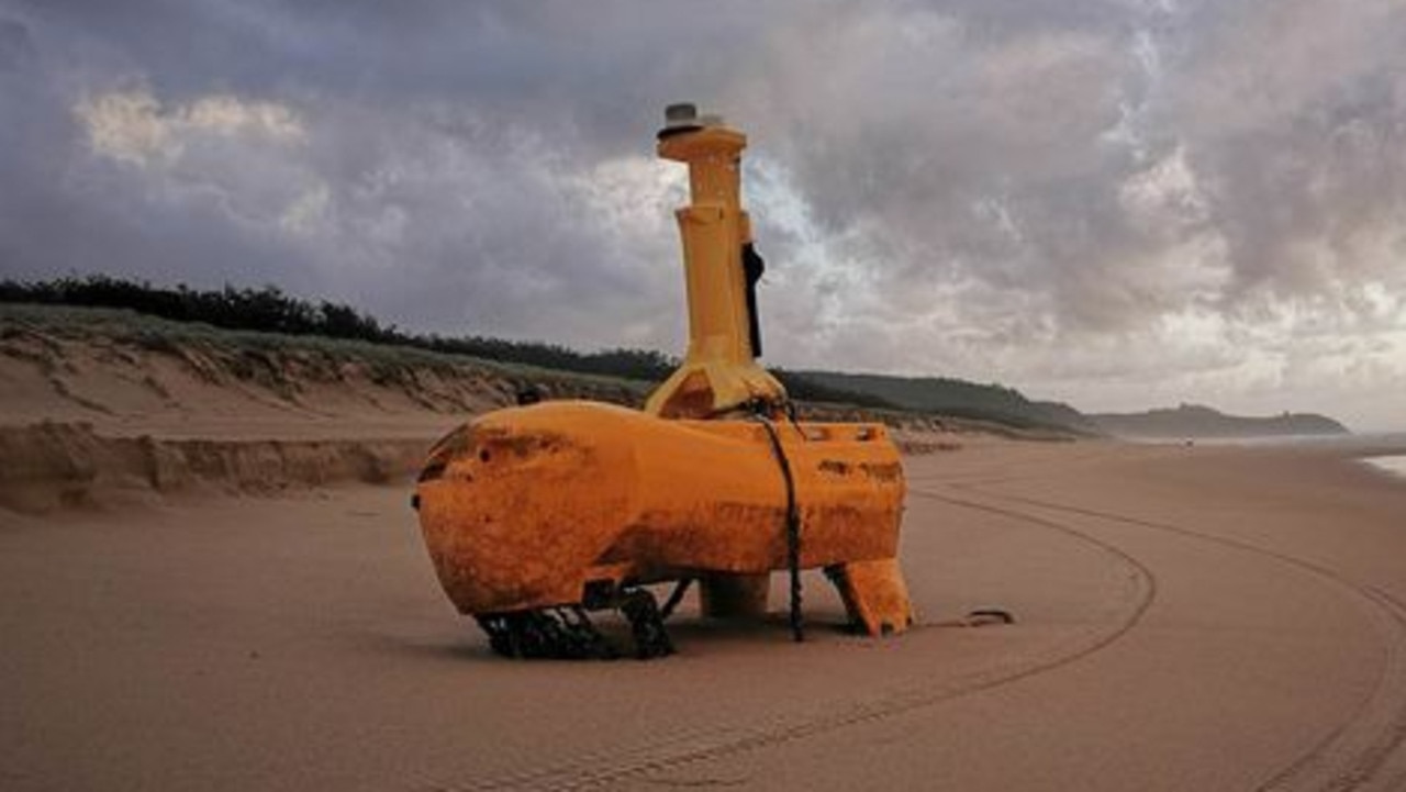 A mystery yellow object has washed up on Teewah Beach with speculation rife online as to its use. Picture: Geoff Feeley