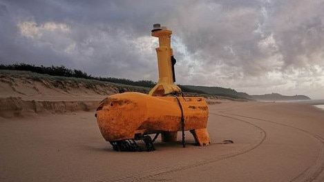 A mystery yellow object has washed up on Teewah Beach with speculation rife online as to its use. Picture: Geoff Feeley