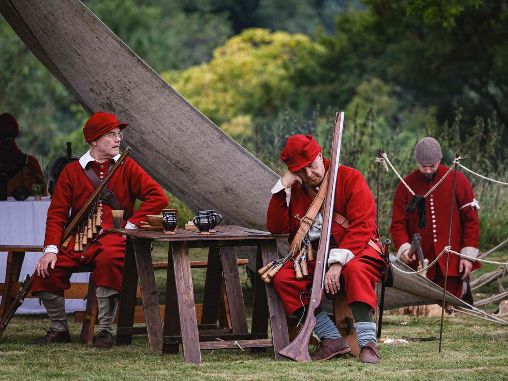 Members of The Marquis of Winchester Regiment take a break after a re-enactment of the 1645 English Civil War, at Old Basing House in the south-east of England. After the defeat of King Charles I's army in June 1645, Oliver Cromwell led part of the New Model Army to “mop up” remaining royalist bases in Wiltshire and Hampshire. He appeared before Basing House around October 8, determined to capture the major royalist stronghold. He subjected the place to heavy bombardment and on October 14, succeeded in capturing the base. Picture: Adrian Dennis/AFP
