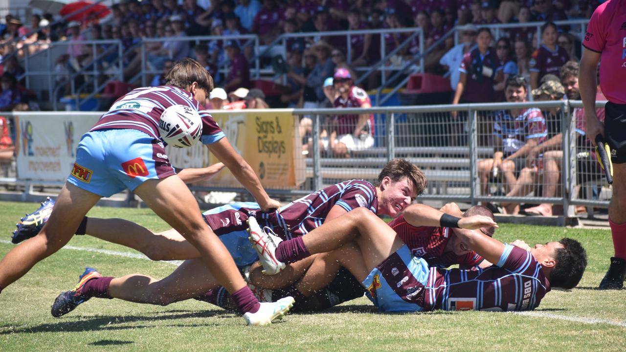 CQ Capras players (from left) Tyler Melrose, Eli McKay and Leo Fanuatanu bundle a Mackay Cutters.