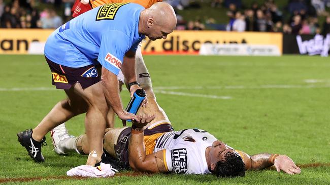 Kotoni Staggs receives attention from the trainers, before being ordered off the ground. Picture: Getty Images