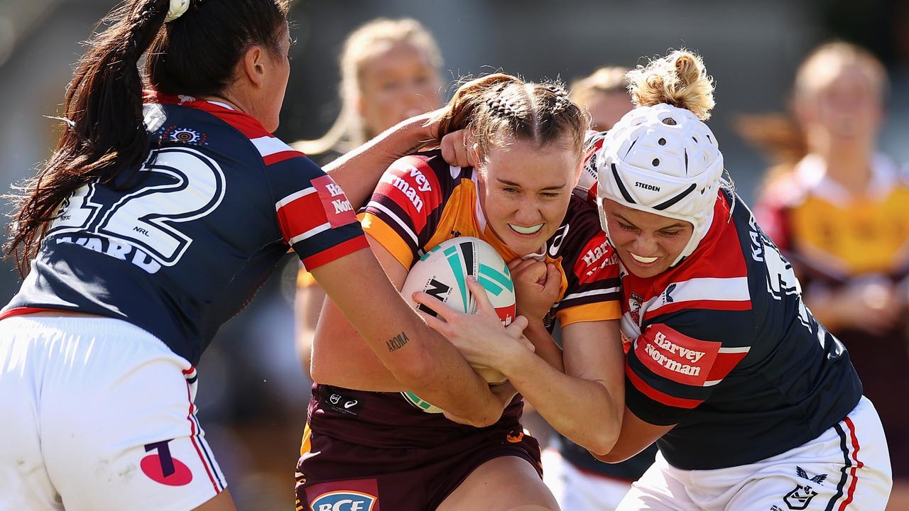 Tamika Upton (centre) will earn $100,000 with the Newcastle Knights next season.