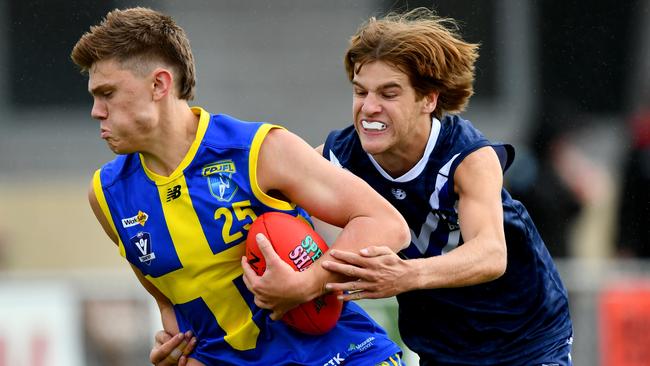 Corey Slefendorfas of Frankston District is tackled. (Photo by Josh Chadwick)