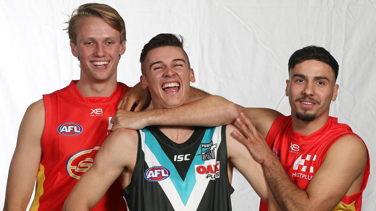 Jack Lukosius and Izak Rankine razz up Connor Rozee after the SA trio were drafted in the top 10 in 2018. Picture: Michael Klein