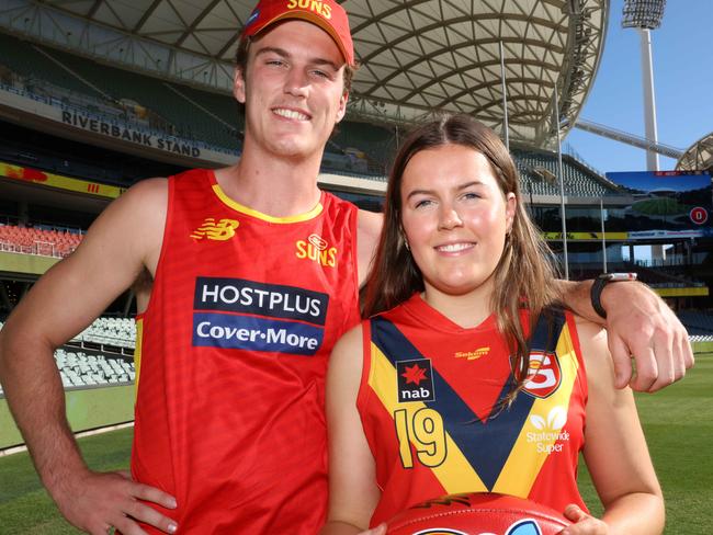 ADELAIDE, AUSTRALIA - NewsWire Photos APRIL 1, 2021: AFL player Charlie Ballard, a former SA footballer who now plays for Gold Coast Suns, with his younger sister Alex who plays for Sturt in the SANFLW and is in the under-19 AFLW state squad at Adelaide Oval War Memorial Dr, North Adelaide. Picture: NCA NewsWire / Emma Brasier