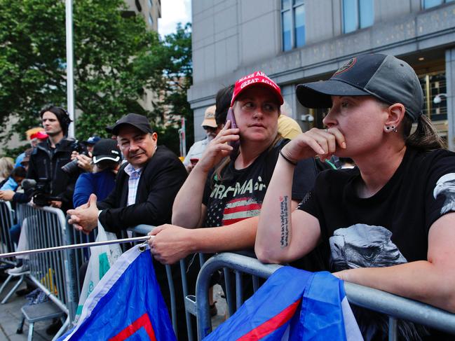 Trump supporters react as a verdict was reached in the criminal trial of former US President and Republican presidential candidate Donald Trump, in Collect Pond Park across the street from Manhattan Criminal Court on May 30, 2024 in New York City. Jurors return May 30, 2024 to a second day of deliberations in Donald Trump's criminal trial, leaving the Republican presidential candidate and the country waiting for a decision that could upend November's election. (Photo by Kena Betancur / AFP)