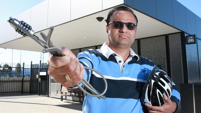 Amit Garg with the lock which was cut at the bike shed at Tallawong Metro station where he had his bike stolen. Picture: Mark Scott