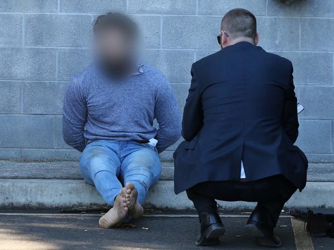 Joint Counter-Terrorism Taskforce arrest involving officers from the Australian Federal Police, NSW Police, ASIO, and other government agencies. Picture: Police Media