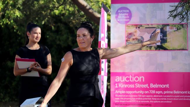 Michelle Winckle calls for bids at 1 Kinross St, Belmont, an ex-rental property that was snapped up after auction by young buyers prepared to renovate.