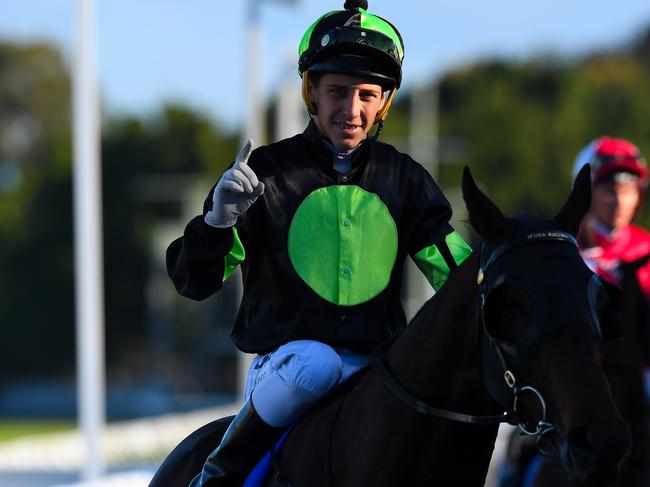 Jockey Jag Guthmann-Chester gestures after riding Lothario to win race 8, the CNW Electrical Wholesale Class 6 Handicap during the CNW Raceday at Aquis Park in the Gold Coast, Saturday, August 26, 2017. (AAP Image/Albert Perez) NO ARCHIVING, EDITORIAL USE ONLY