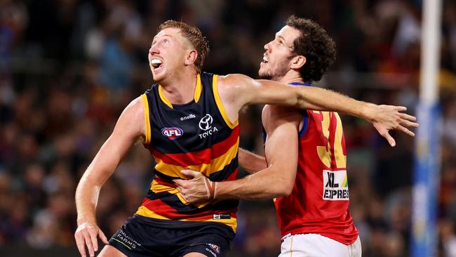 Kieran Strachan competes with Darcy Fort at Adelaide Oval. Picture: James Elsby/AFL Photos via Getty Images