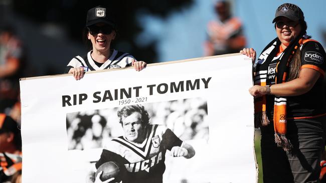 A fan holds up a tribute to Tommy Raudonikis at Leichhardt Oval on Sunday. Picture: Getty Images