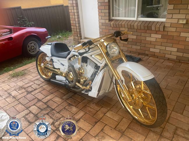 Four luxury vehicles and a motorcycle valued over $2m were seized by police. Picture: Tasmania and NSW Police.