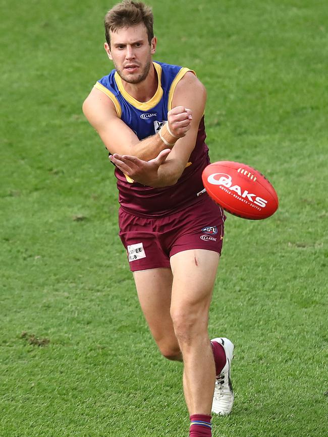 Grant Birchall fires out a handball on his Brisbane debut against Fremantle last weekend. Picture: Jono Searle