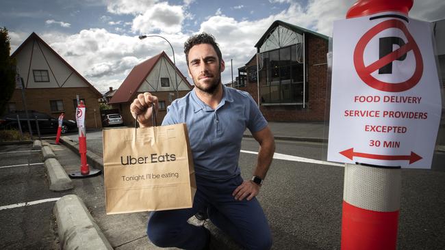 North Hobart Traders Association president and The Burger Haus part-owner Aaron Brazendale at the new parking spaces for food delivery service providers in the Condell Place carpark. Picture: CHRIS KIDD