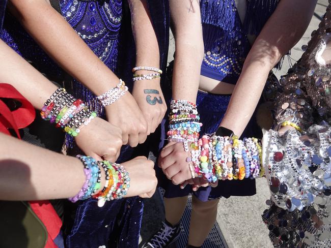 Taylor Swift fans exchange friendship bracelets at the MCG. Picture: Valeriu Campan