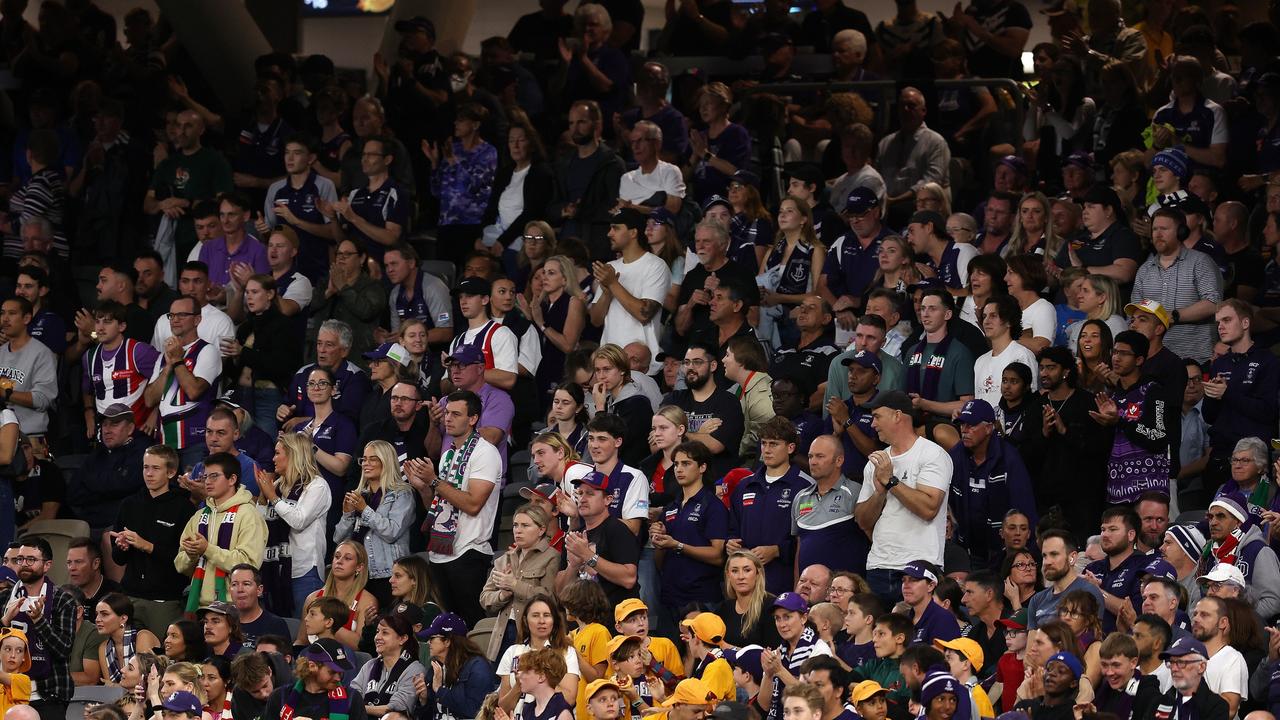 The crowd honour former player Cam McCarthy by standing and applauding at the 23rd minute of the first quarter. Picture: Getty Images