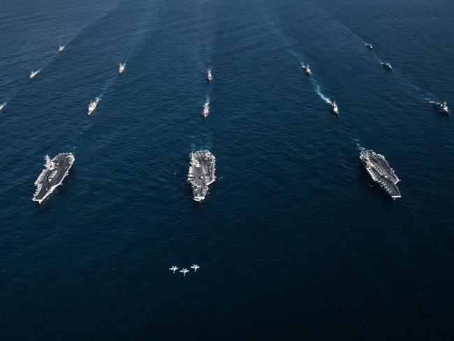 This image released by the US Navy on November 12, 2017, shows three F/A-18E Super Hornets fly in formation over the aircraft carriers USS Ronald Reagan, USS Theodore Roosevelt, USS Nimitz and their strike groups along with ships from the Republic of Korea Navy as they transit the Western Pacific.