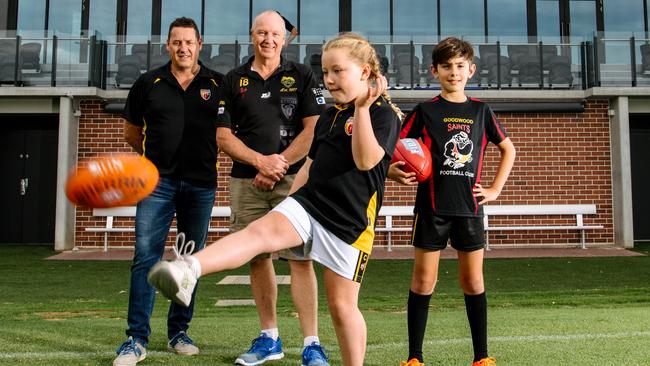 Goodwood Football Club president Craig Scott, junior football director Andrew Braley, with players Holly, 8, and Harrison, 11. The Saints have been named the best junior sporting club in Australia in Adelaide. Picture: Morgan Sette