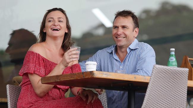 Buttrose with his new partner, Sydney PR queen Tiffany Farrington, at a coffee shop in Centennial Park. Picture: Richard Dobson