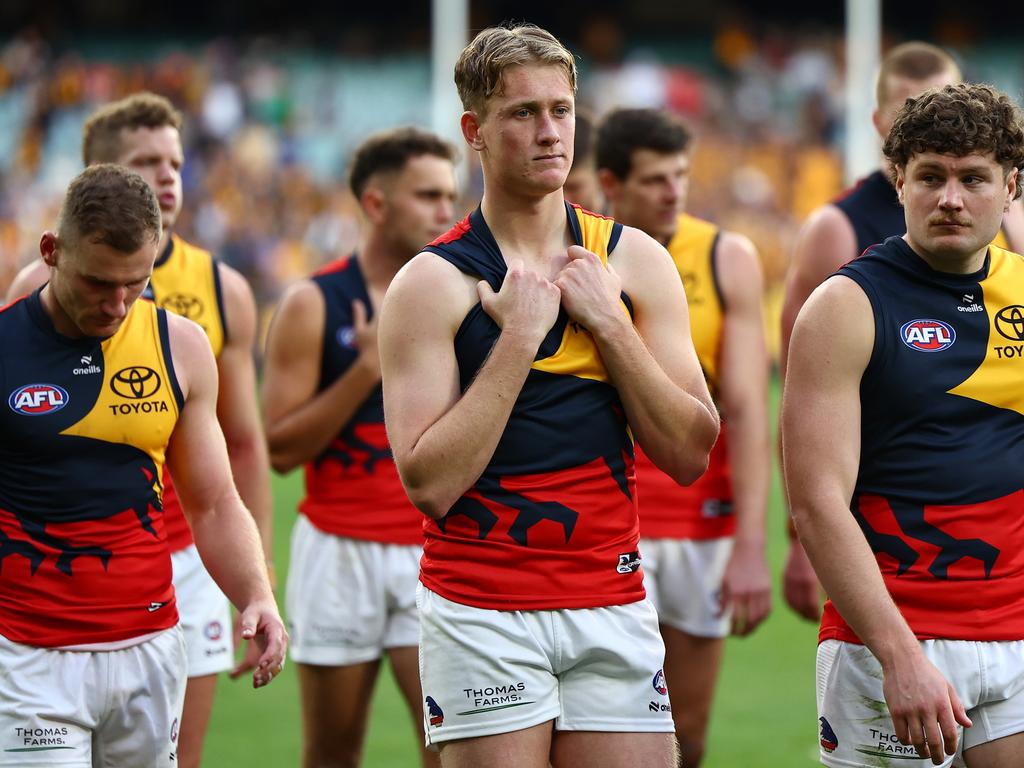 Brayden Cook and his Crows' teammates look dejected after losing the round 12 AFL match between Hawthorn Hawks and Adelaide Crows at Melbourne Cricket Ground, on June 01, 2024, in Melbourne, Australia. (Photo by Quinn Rooney/Getty Images)