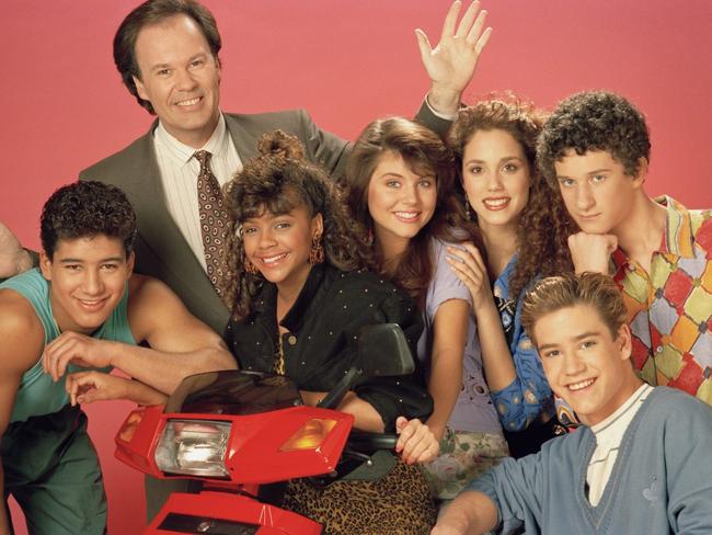 (l-r) Mario Lopez as Alabert Clifford 'A.C.' Slater, Dennis Haskins as Mr. Richard Belding, Lark Voorhies as Lisa Turtle, Tiffani Thiessen as Kelly Kapowski, Elizabeth Berkley as Jessie Spano, Mark-Paul Gosselaar as Zachary 'Zach' Morris, Dustin Diamond as Screech Powers.