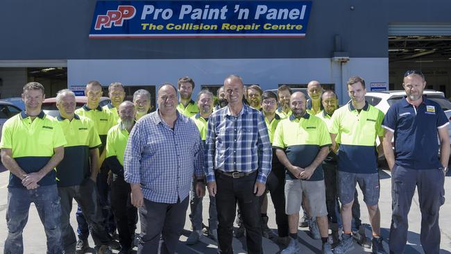 Pro Paint ‘n Panel brothers and owners, Kon and Tom Skothos, with staff at their Hindmarsh business. Picture: Roy VanDerVegt