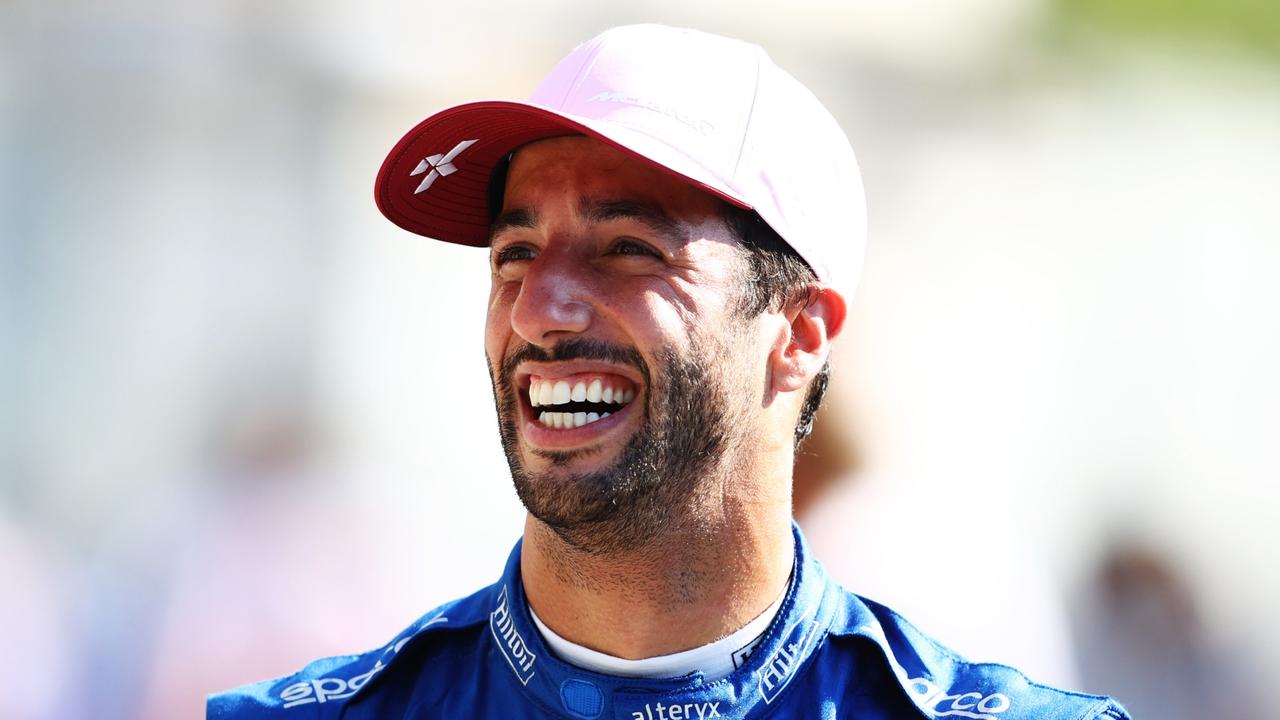 Mclaren driver Daniel Ricciardo of Australia shows a tattoo on his