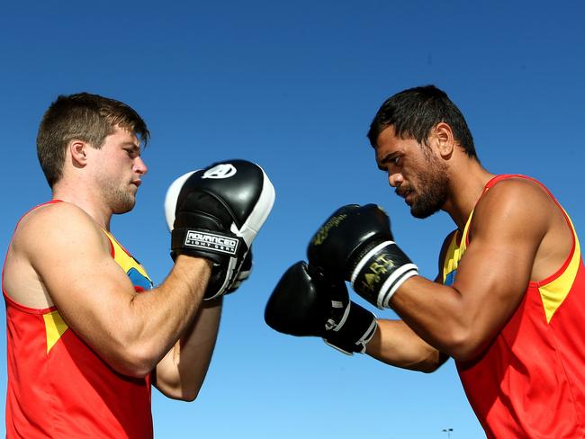 Karmichael Hunt (R) engages in some boxing training with Gold Coast Suns teammate Jackson Allen.