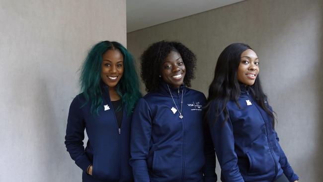 Members of the Nigerian women's bobsled team, from left, Akuoma Omeoga, Seun Adigun and Ngozi Onwumere, pose for a photograph during an interview with The Associated Press at the 2018 Winter Olympics in Pyeongchang, South Korea, Tuesday, Feb. 13, 2018. Despite being American born, Nigeriaâ€™s first-ever bobsled team says theyâ€™re representing the culture they were raised in.   (AP Photo/Patrick Semansky)