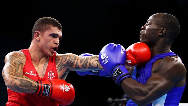 Australia’s Clay Waterman jabs during his victory over Zambia’s Mbachi Kaonga yesterday. Photo: Getty Images