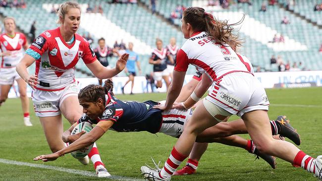 Roosters star Taleena Simon scores her second try against the Dragons on Saturday. Picture: Brett Costello