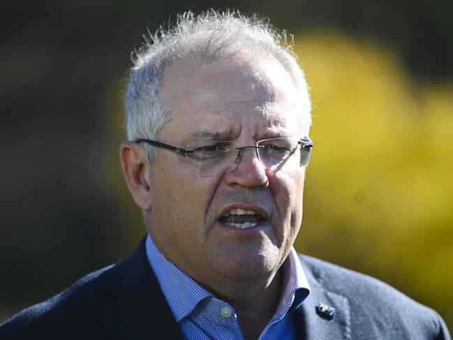 Australian Prime Minister Scott Morrison speaks to the media during a visit to Robyn Rowe Chocolates with the Liberal candidate for the seat of Eden-Monaro Fiona Kotvojs in Murrumbateman near Canberra, Sunday, May 24, 2020. (AAP Image/Lukas Coch) NO ARCHIVING