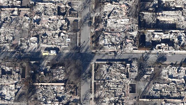 A fire truck near homes destroyed in the Palisades Fire as wildfires cause damage and loss through the LA region in California. Multiple wildfires fuelled by intense winds continue to burn across Los Angeles County. Picture: Mario Tam/Getty Images via AFP