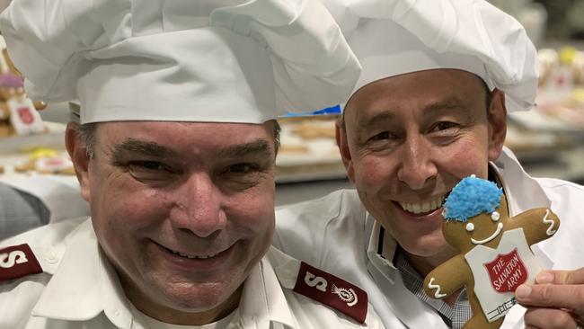 Maj Brendan Nottle (left) with Ferguson Plarre CEO Steve Plarre with the new charity biscuit.