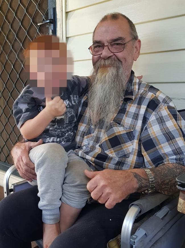 Lacky pictured with one of his grandchildren. Picture: Facebook