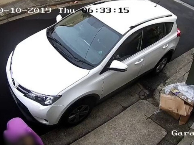 A woman relieving herself between two cars was caught on CCTV footage in Paddington in 2019. Picture: Instagram/Roxy Jacenko