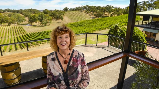 Paracombe Wines’ Kathy Drogemuller in front of the vineyard they built in the wake of the Ash Wednesday fires. Picture: Roy VanDerVegt