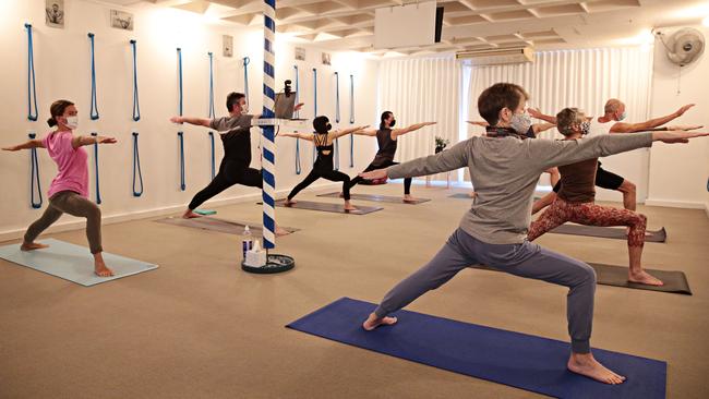 A masked class at Central Yoga School in Surry Hills, inner-city Sydney, on Thursday. Picture: Adam Yip