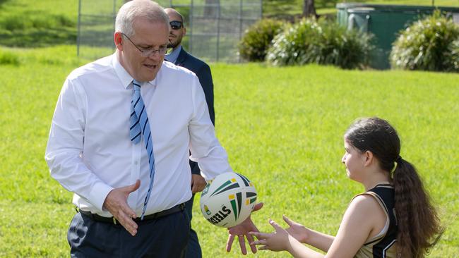 The students were lucky Scott Morrison didn’t follow Boris Johnson’s lead while playing footy. Picture: Jason Edwards